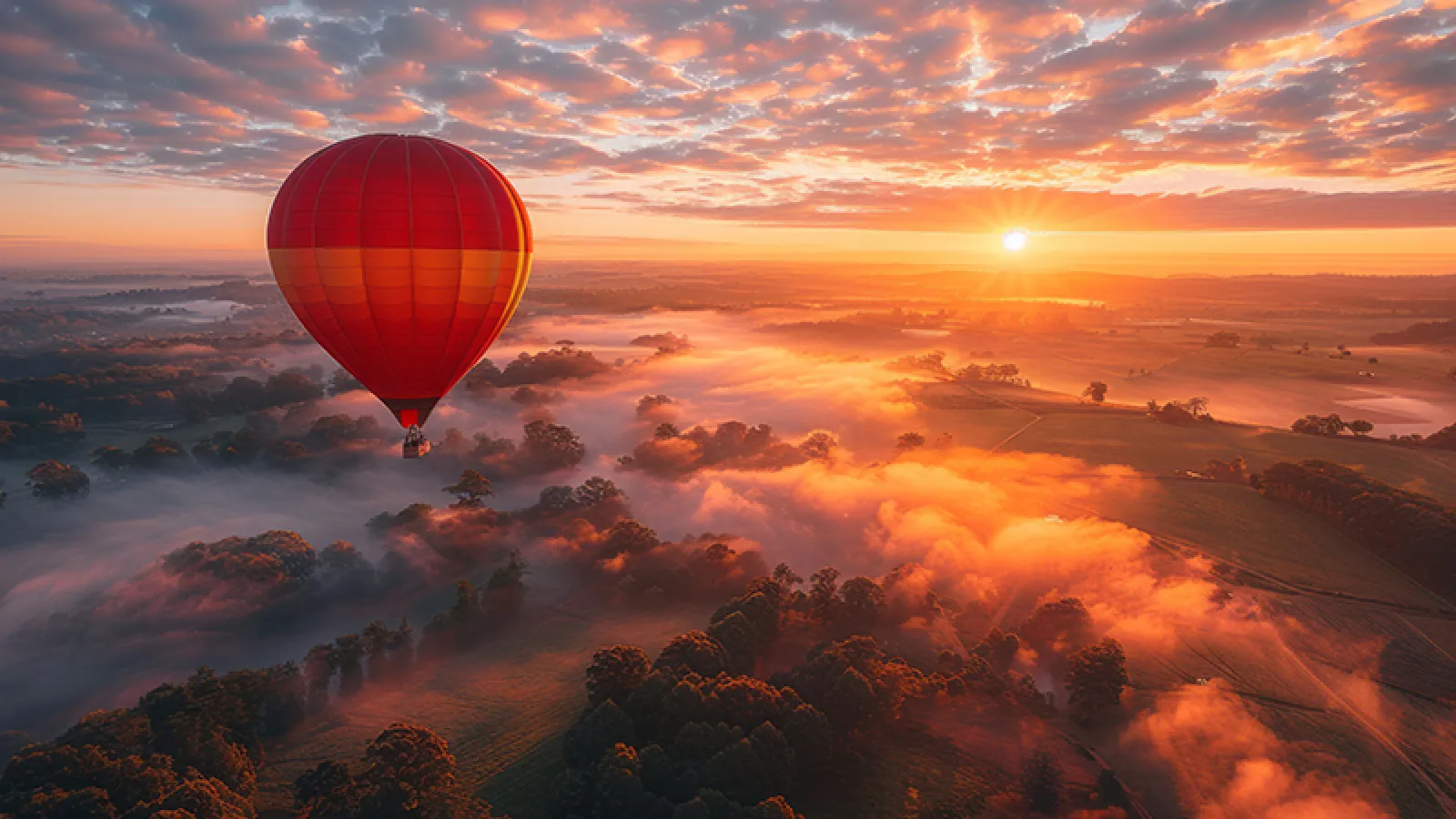 Stock photo - balloon and sunrise over fog