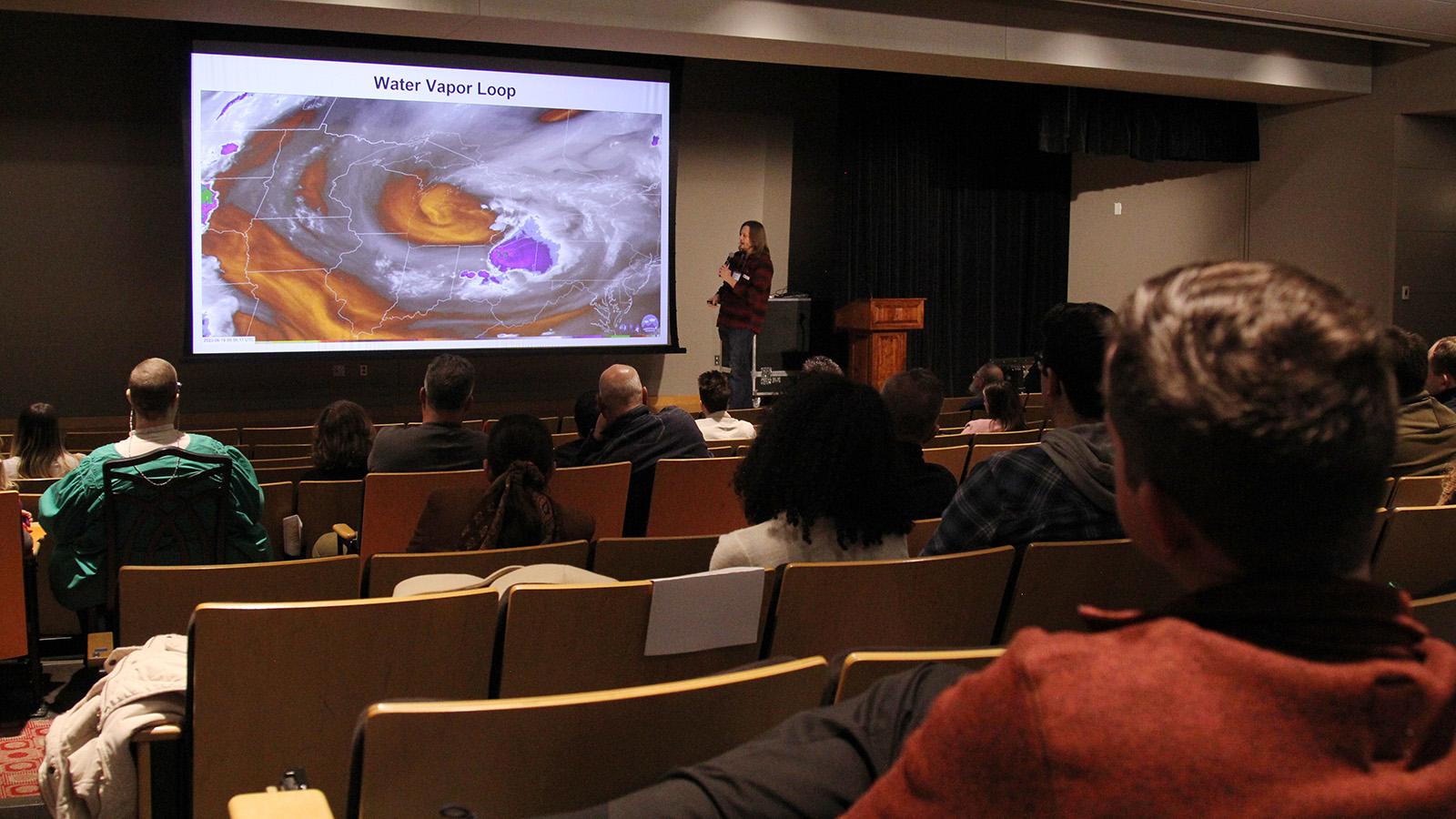 Photo of Jim Sullivan explaining image of water vapor loop